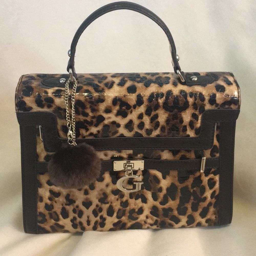 New Cheetah Guess purse with pom-pom.